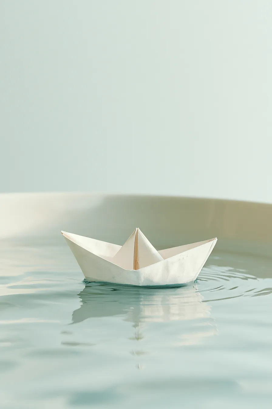 A paper boat on calm water, the steadiness an emergency fund buys a household